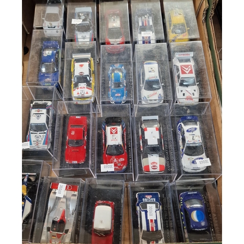 324 - Three trays of diecast model vehicles of Rally or Touring cars in perspex cases. Approximately 55.  ... 