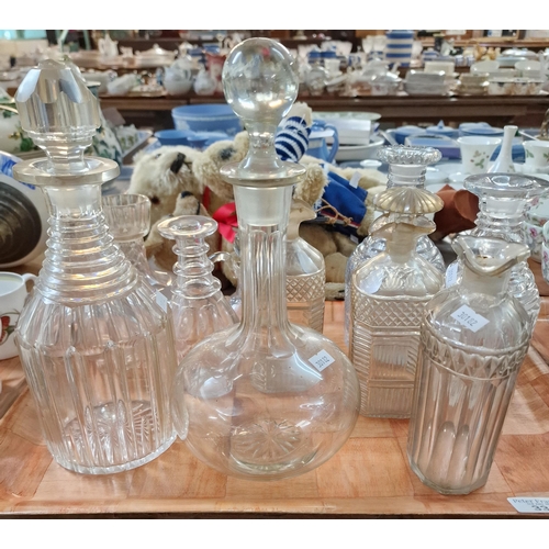 334 - Tray of 19th century glassware to include: various decanters and stoppers, vinegar bottle and stoppe... 