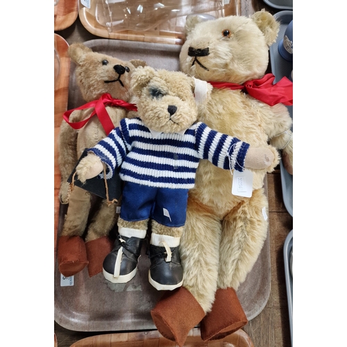 335 - Two mohair teddy bears with stitched noses and moveable limbs together with another modern teddy bea... 