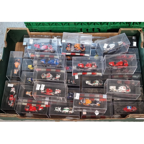 394 - A collection of die cast scale model  racing motorbikes in perspex cases (B.P. 21% + VAT)