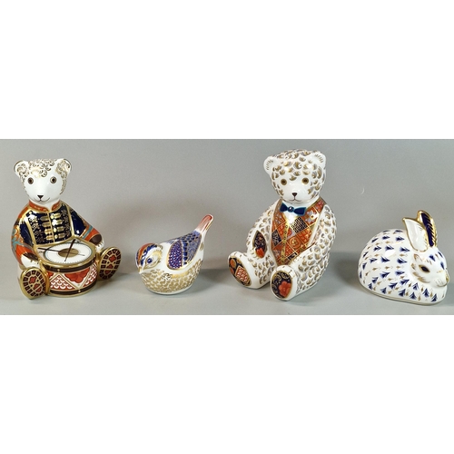 4 - Four Royal Crown Derby bone china paperweights to include: two teddy bears one with drums, recumbent... 