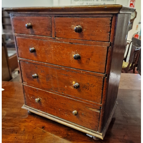 415 - A miniature, stained pine apprentice straight front chest of two short and three long drawers with k... 