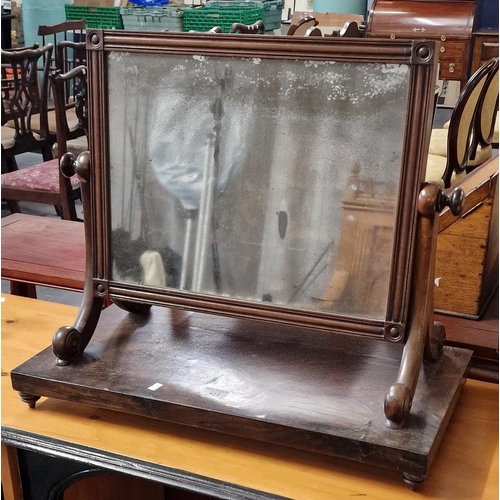 423 - 19th century mahogany bedroom swivel mirror on turned feet (B.P. 21% + VAT)