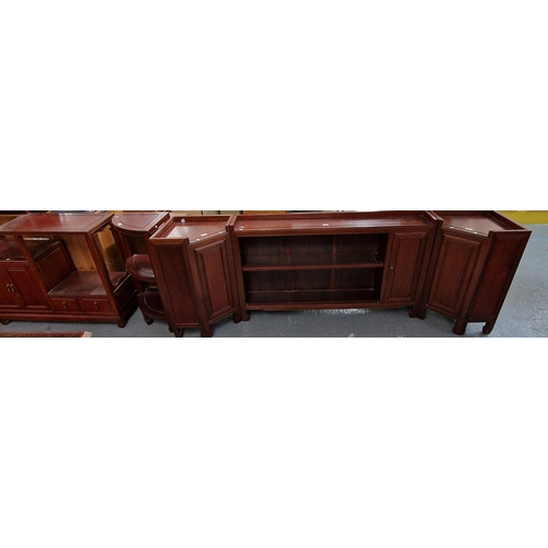 426 - 20th century Chinese hardwood low bookcase with matching angled lamp cupboards, a similar hardwood c... 