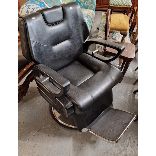 447 - 20th century deeply upholstered fully adjustable revolving pedestal barbers' chair. (B.P. 21% + VAT)