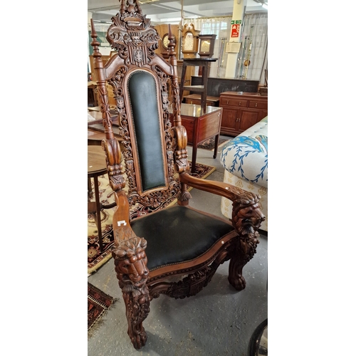 451 - A modern reproduction carved hardwood 'throne' type chair, carved and pierced back with carved crest... 