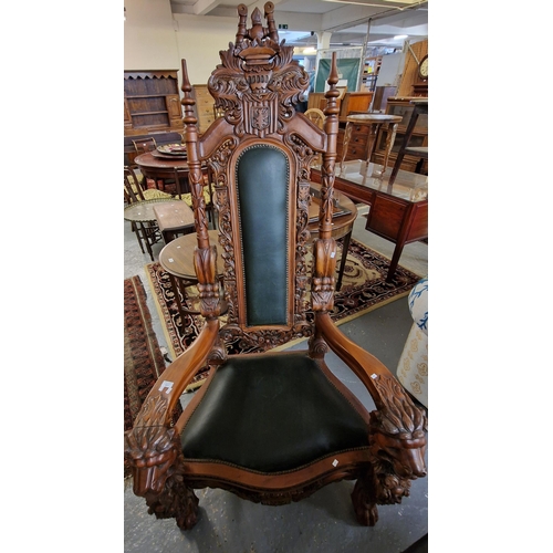 451 - A modern reproduction carved hardwood 'throne' type chair, carved and pierced back with carved crest... 