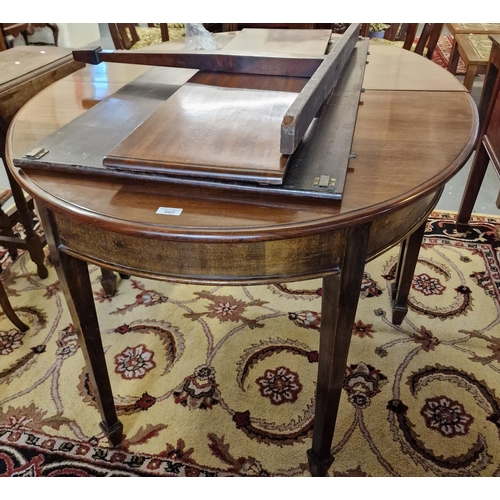 460 - Georgian style mahogany extending D ended dining table with two additional leaves on square tapering... 