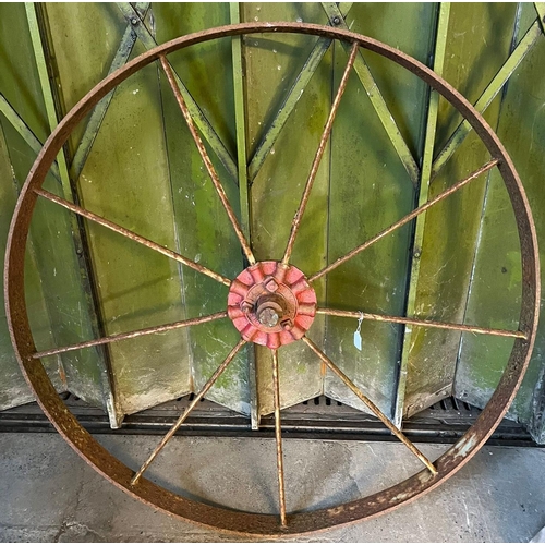 491 - A cast iron nine spoke wagon wheel marked 'Bamfords Uttoxeter' (B.P. 21% + VAT)