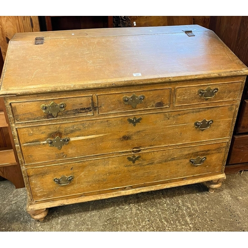 501 - 19th century pine corn bin, the fall front above a bank of dummy drawers on baluster turned feet (B.... 