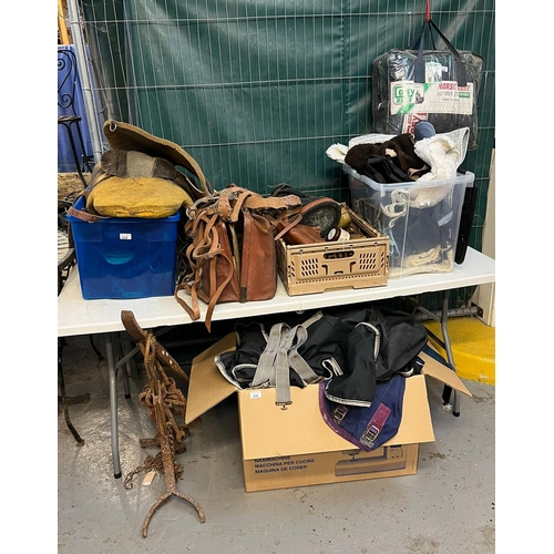 508 - Equestrian - crate of assorted leather harness, back pads and assorted other items, together with a ... 