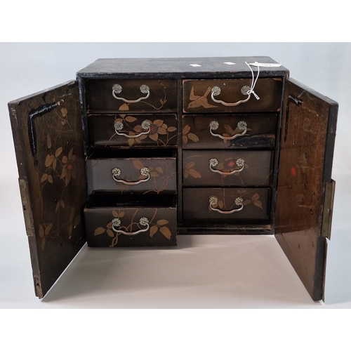 51 - Japanese Export gilt lacquered jewellery cabinet with engraved metal fittings, the interior revealin... 