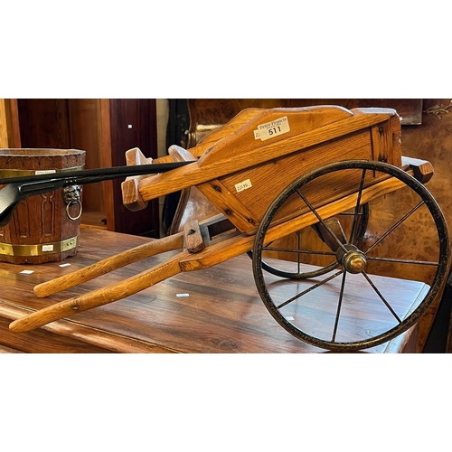 511 - An elm miniature model study of a governess cart with metal wheels and two riding crops (B.P. 21% + ... 