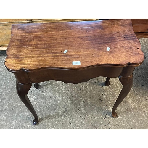 514 - An 18th century mahogany fold over card table, the moulded and shaped serpentine top above a plain f... 