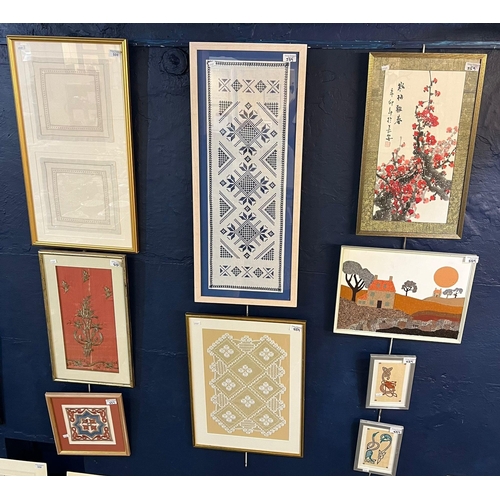 559 - A group of assorted framed textile panels including lace, needlepoint, khivan silk and others. (9) v... 