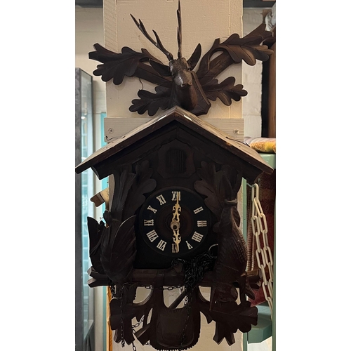 76A - 20th century carved wooden stained Bavarian Cuckoo Clock with weight, chains and pendulum. (B.P. 21%... 