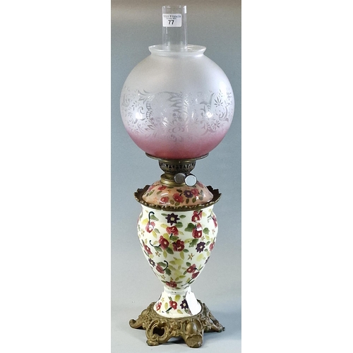 77 - Early 20th century double oil burner lamp having frosted and etched globular shade above a ceramic  ... 