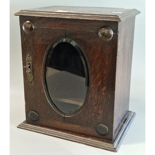 87 - Early 20th century oak smoker's cabinet with mirrored door, and key.  (B.P. 21% + VAT)