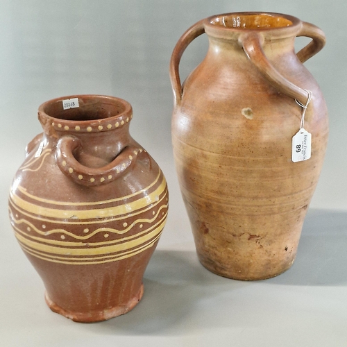 89 - Welsh Claypits Ewenny Pottery baluster shaped jug with entwined handles and slip glazed banded decor... 