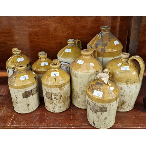 90 - Collection of vintage stoneware flagons, some with various labels including: 'Medicinal Liquid Paraf... 