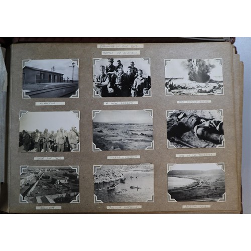 133 - Two leather bound photo albums from 1940's with assortment of military interest photos from Middle E... 