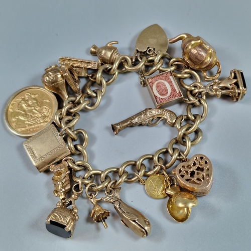 102 - 9ct gold curb-link charm bracelet to include: Queen Elizabeth II gold full sovereign dated 1964, hea... 