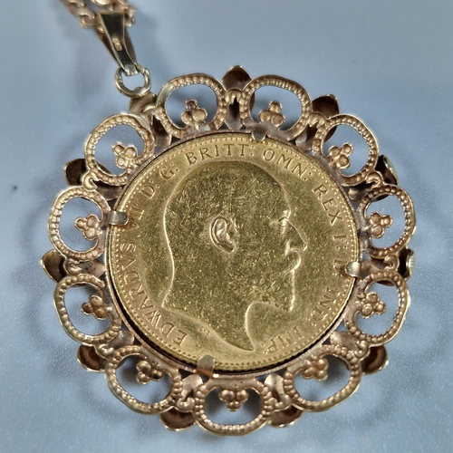 107 - Edward VII gold full Sovereign dated 1907 in ornate 9ct gold mount on a 9ct gold fine link chain.  T... 