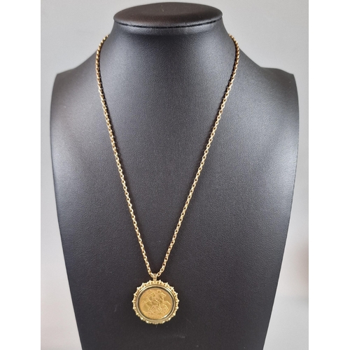 108 - Edward VII gold full Sovereign dated 1905 in ornate 9ct gold mount on a 9ct gold chain. The chain 42... 