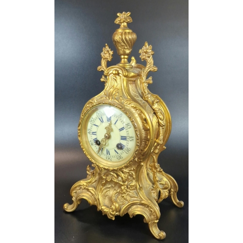 10A - French Rococo style ormolu balloon shaped two train mantle clock with urn finial, foliate mounts and... 