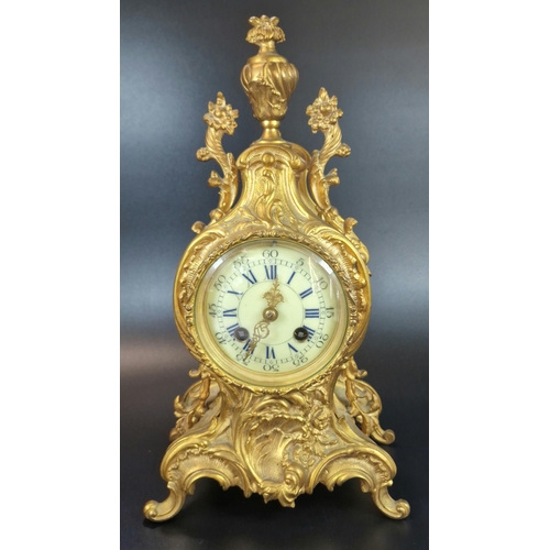 10A - French Rococo style ormolu balloon shaped two train mantle clock with urn finial, foliate mounts and... 