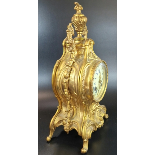 10A - French Rococo style ormolu balloon shaped two train mantle clock with urn finial, foliate mounts and... 