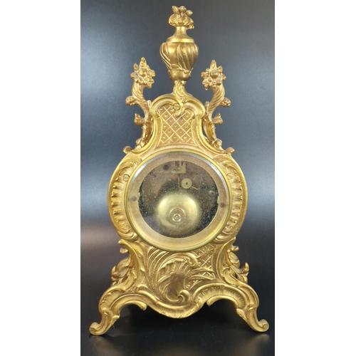 10A - French Rococo style ormolu balloon shaped two train mantle clock with urn finial, foliate mounts and... 