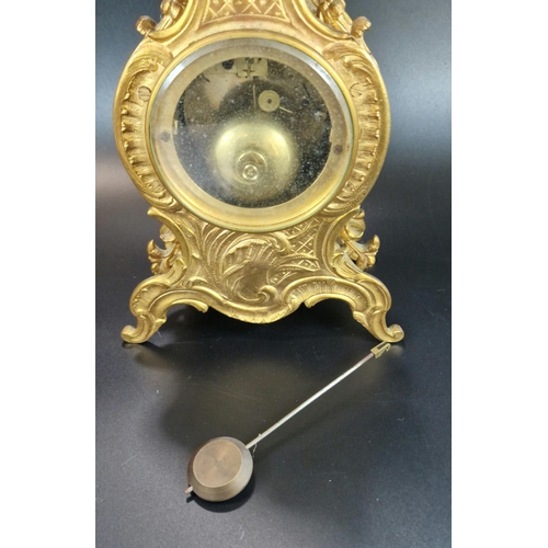 10A - French Rococo style ormolu balloon shaped two train mantle clock with urn finial, foliate mounts and... 