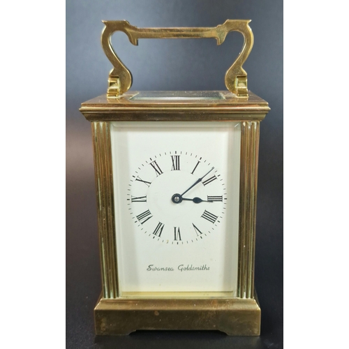 11 - French brass carriage clock, having fluted gorge case and full depth Roman face marked 'Swansea Gold... 