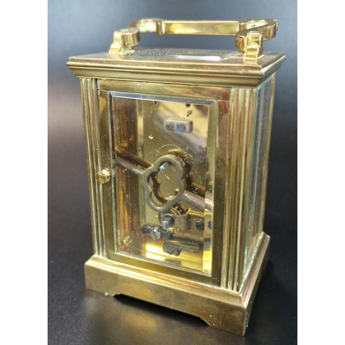 11 - French brass carriage clock, having fluted gorge case and full depth Roman face marked 'Swansea Gold... 