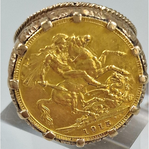 112 - George V gold full Sovereign dated 1915 set in a 9ct gold pierced foliate ring mount. Total weight 1... 