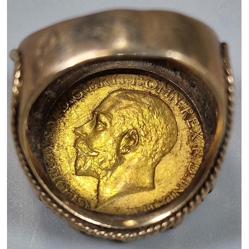 112 - George V gold full Sovereign dated 1915 set in a 9ct gold pierced foliate ring mount. Total weight 1... 