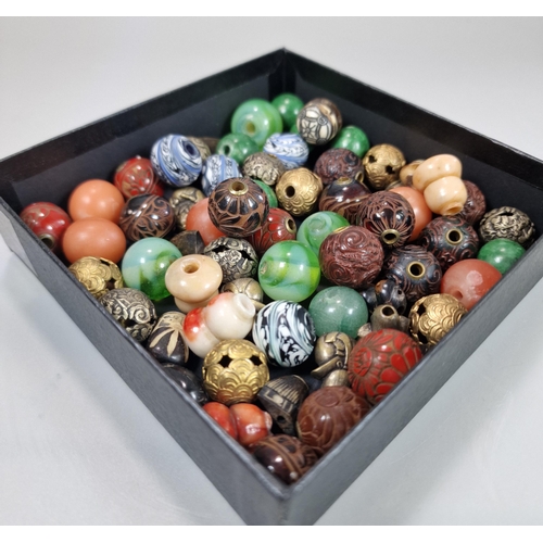 152 - Group of sixty two Japanese Ojime beads in a variety of materials: lacquered wood, hardstones, metal... 