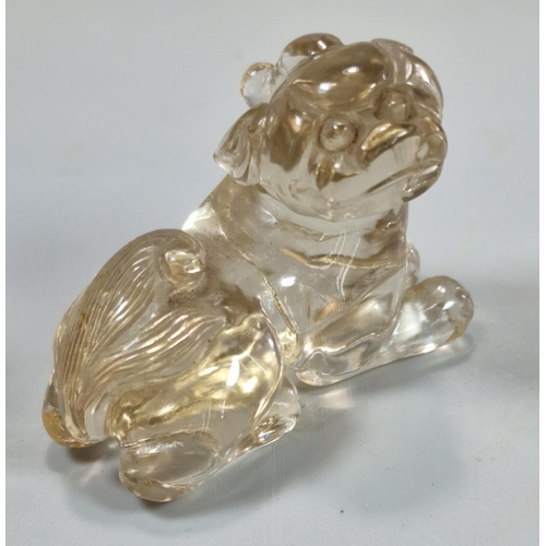 155 - Two carved Rock Crystal figures to include: a recumbent Chilong Dragon together with a mythical dog.... 