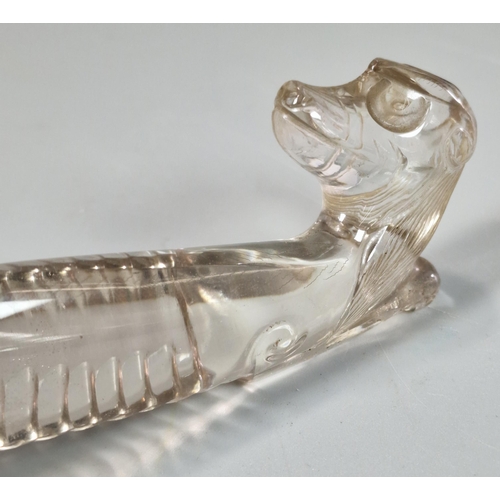 155 - Two carved Rock Crystal figures to include: a recumbent Chilong Dragon together with a mythical dog.... 