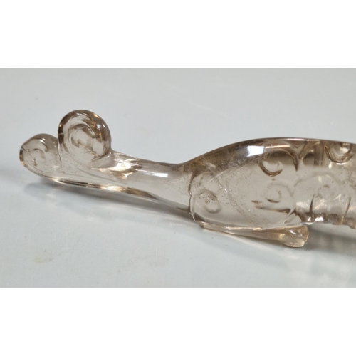 155 - Two carved Rock Crystal figures to include: a recumbent Chilong Dragon together with a mythical dog.... 