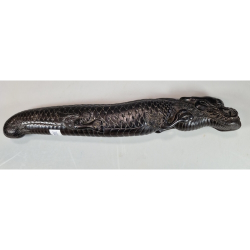 158 - Carved dark hardwood study of a three toed Dragon, intricately carved. Probably Japanese. 26cm long ... 