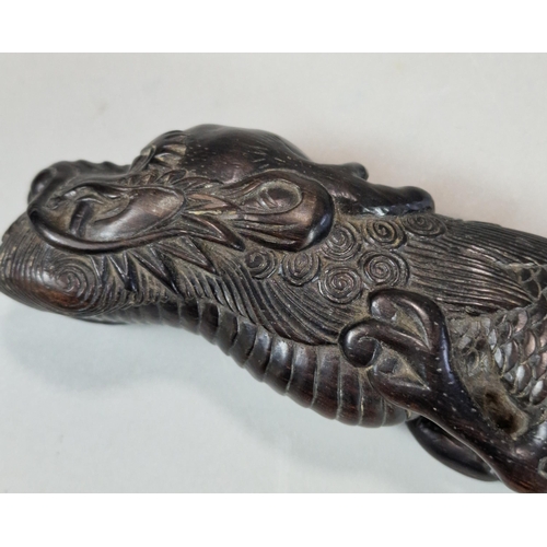 158 - Carved dark hardwood study of a three toed Dragon, intricately carved. Probably Japanese. 26cm long ... 