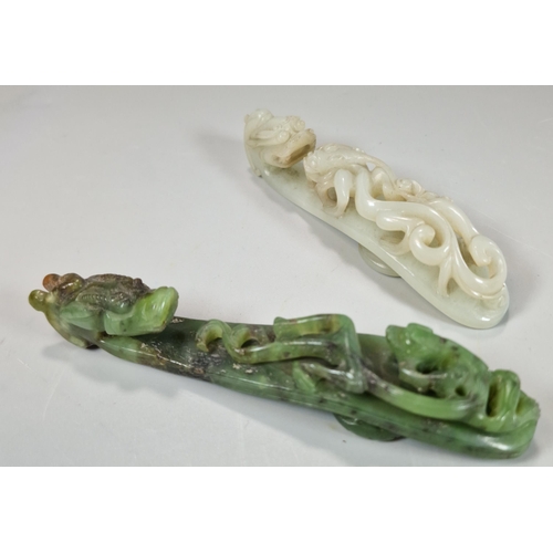 159 - Two finely carved Chinese Dragon and Chilong green and white hardstone belt hooks, each with the dra... 