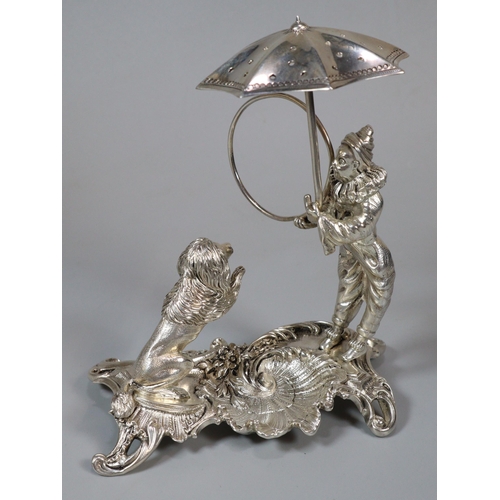 16 - Unusual white metal, probably continental circus figure group of a harlequin with umbrella and ring ... 