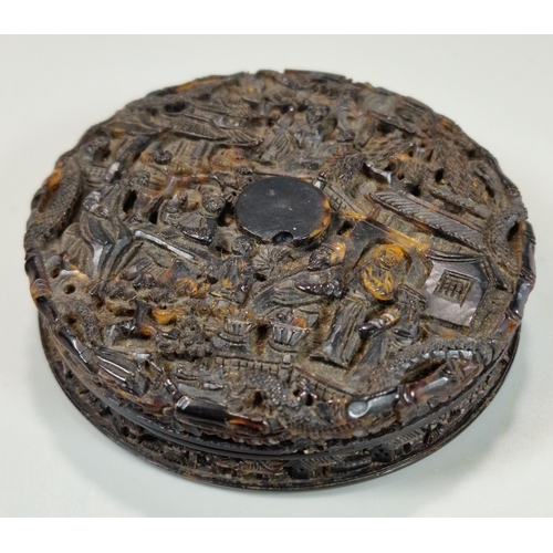 160 - Chinese export ornately and deeply carved tortoiseshell box of circular form depicting multiple figu... 