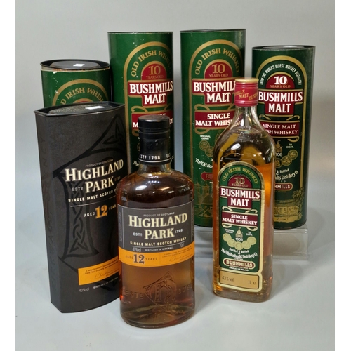 164 - Three bottles of Bushmills Single Malt Whiskey, ten years old in tubular boxes, 1 litre, together wi... 