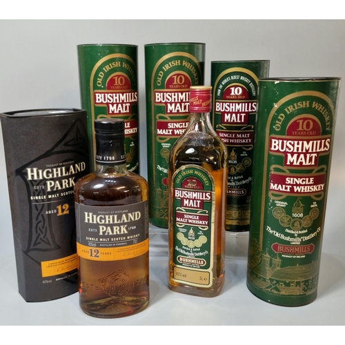 164 - Three bottles of Bushmills Single Malt Whiskey, ten years old in tubular boxes, 1 litre, together wi... 