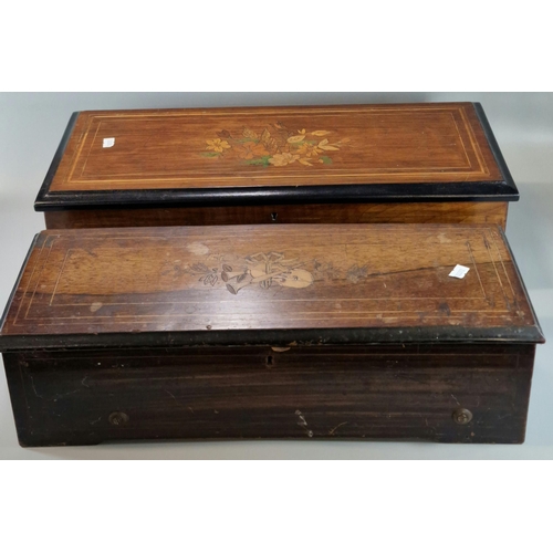 168 - Two 19th century Swiss musical boxes, each having inlaid decoration and strung outlines to the cover... 