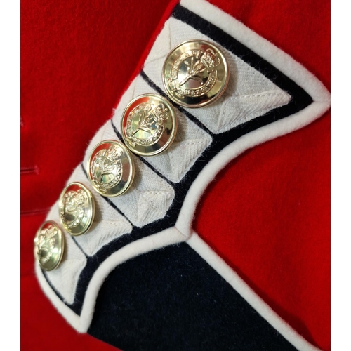 173 - Modern Welsh Guards Dress Tunic. Red wool jacket, black facings, white piping, Welsh Guards insignia... 